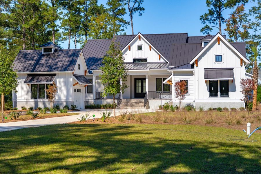 Front exterior of a new home in , Ravenel, SC, highlighting curb appeal (Image 25).