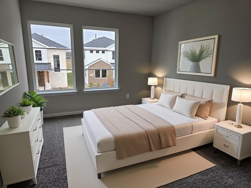 Bedroom featuring dark colored carpet and baseboards Bedroom featuring dark colored carpet and baseboards
