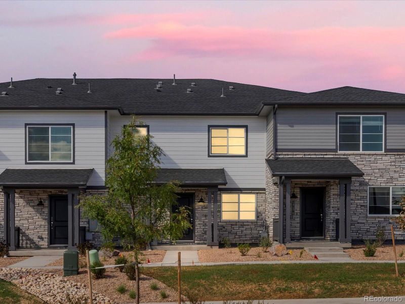Front exterior of a new home in Skyview at High Point, Aurora, CO, highlighting curb appeal (Image 1).