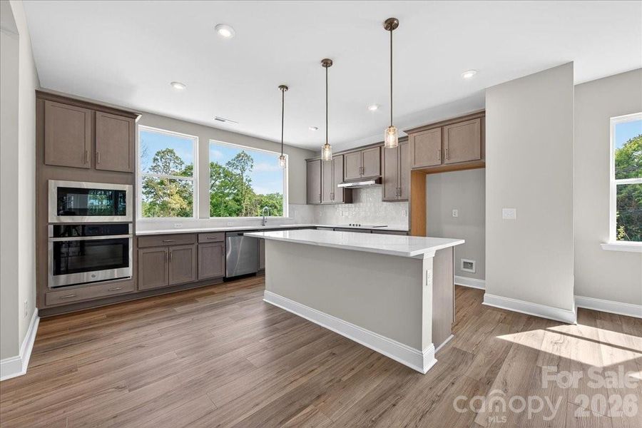 Gourmet kitchen with large windows for ample natural light