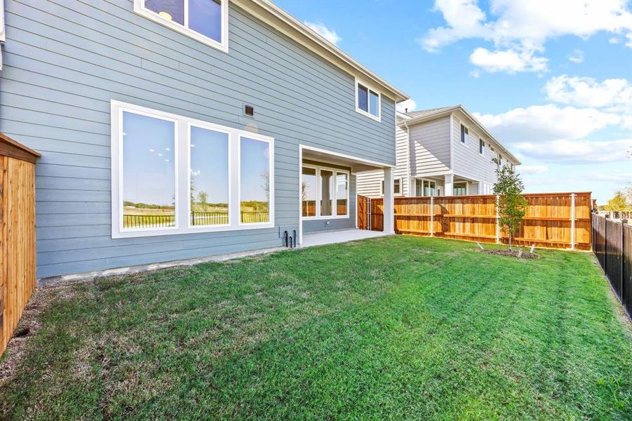 Exterior details and patio area of a home in North Square at Uptown, Celina (Image 3).