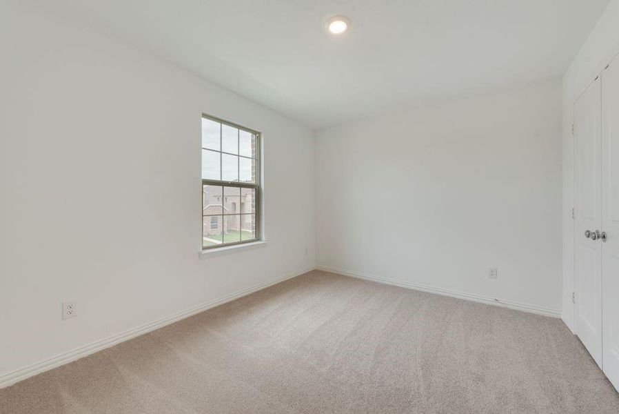 Unfurnished room featuring light carpet Unfurnished room featuring light carpet