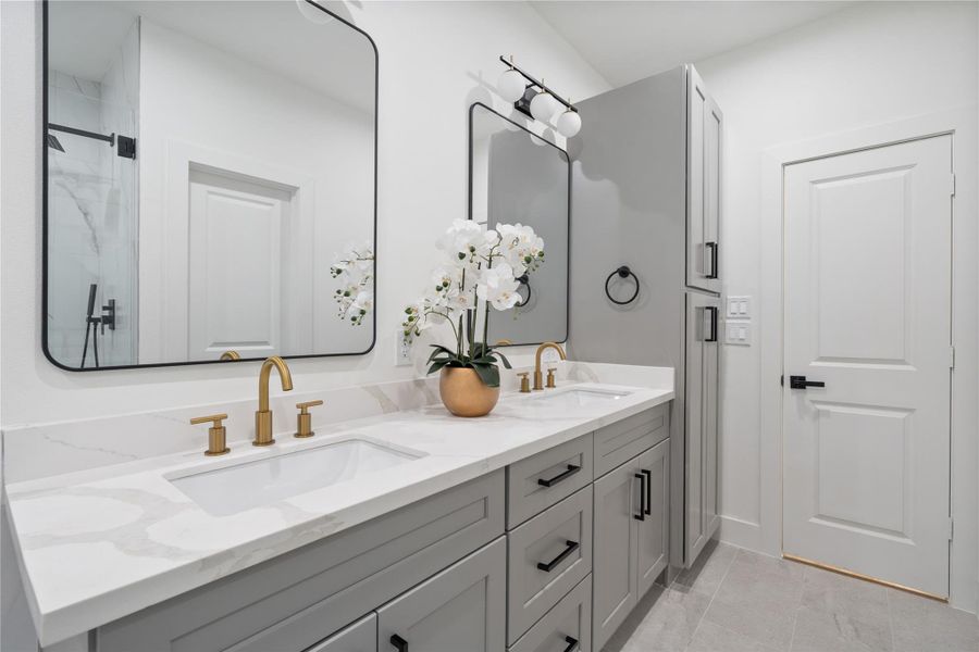 The primary ensuite offers expansive counter space, providing plenty of room for you and your partner to comfortably get ready. Combined with abundant storage, it keeps the space organized and functional. This thoughtful design enhances both convenience and luxury in your daily routine.