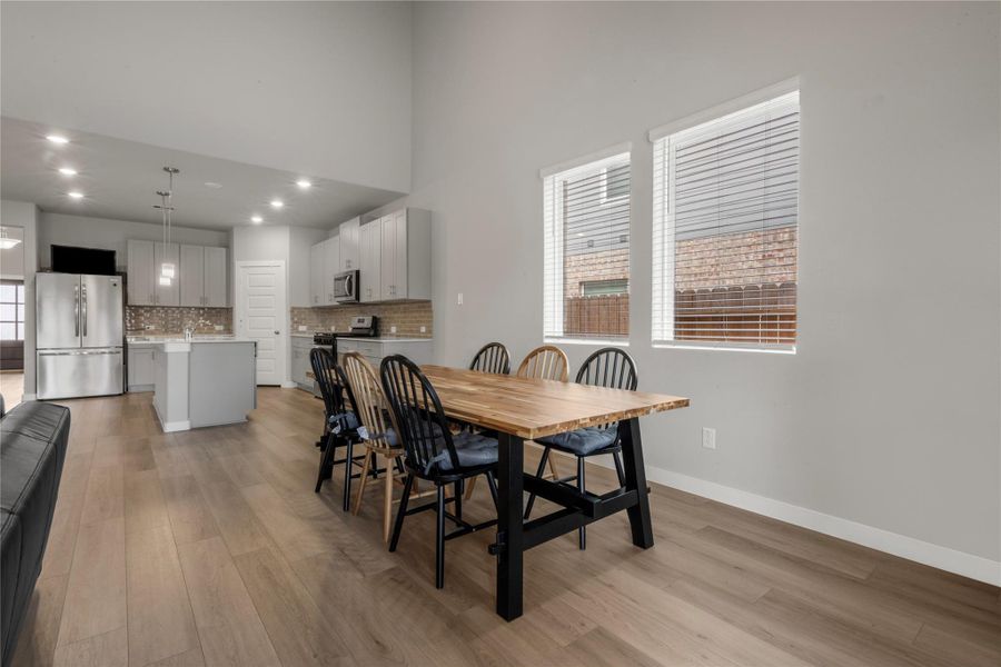 Bright and inviting dining area conveniently located near the kitchen, offering a comfortable space for family meals and gatherings, with a layout that accommodates both casual and formal dining setups.