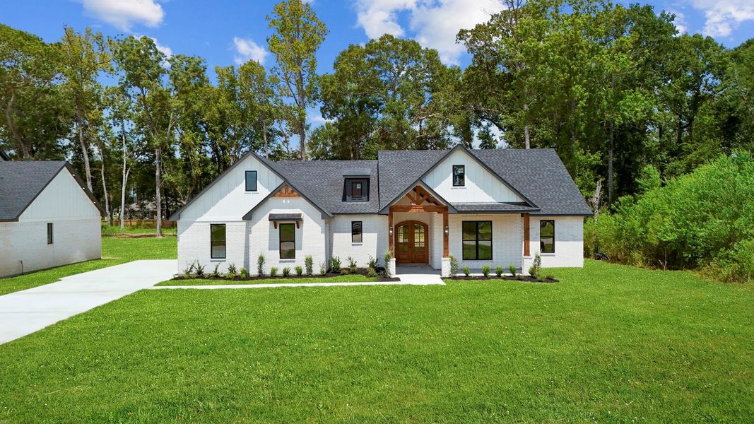 Front exterior of a new home in , Dayton, TX, highlighting curb appeal (Image 26).