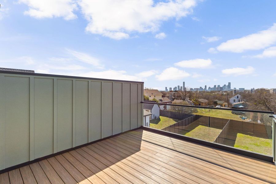 Wooden deck featuring a skyline view