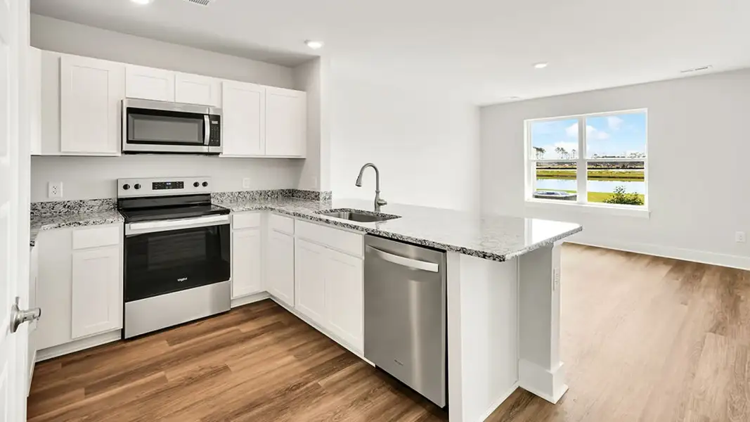 Furnished interior view inside a new home in The Cove at Indigo Preserve Townhomes, Leland (Image 4).