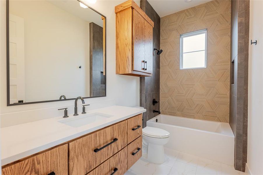 Bathroom with vanity and  shower combination