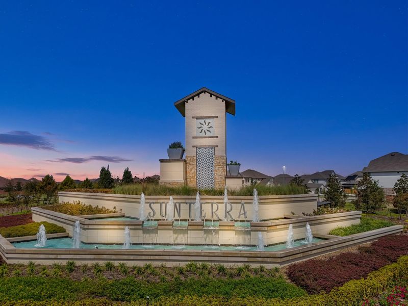 Front exterior of a new home in Sunterra North, Katy, TX, highlighting curb appeal (Image 6). Front exterior of a new home in Sunterra North, Katy, TX, highlighting curb appeal (Image 6).
