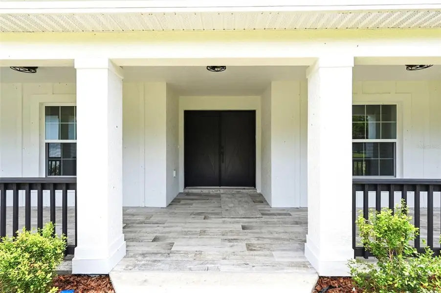 Exterior details and patio area of a home in , Brooksville (Image 28).