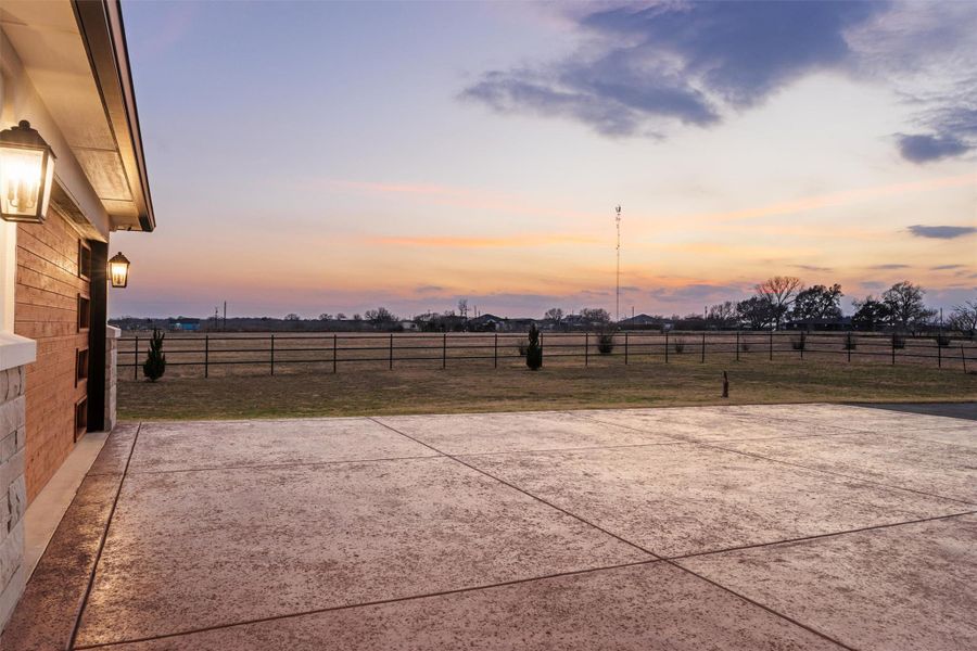 View of land at sunset front of the house.