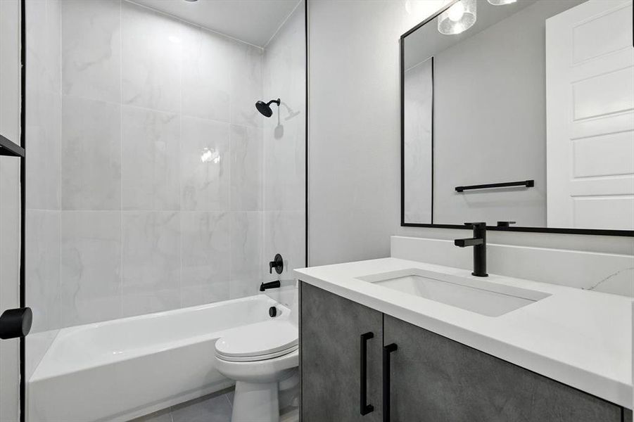 Bathroom featuring vanity and tub / shower combination