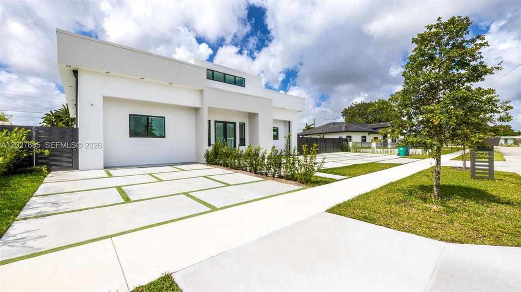 Front exterior of a new home in , Miami, FL, highlighting curb appeal (Image 24).