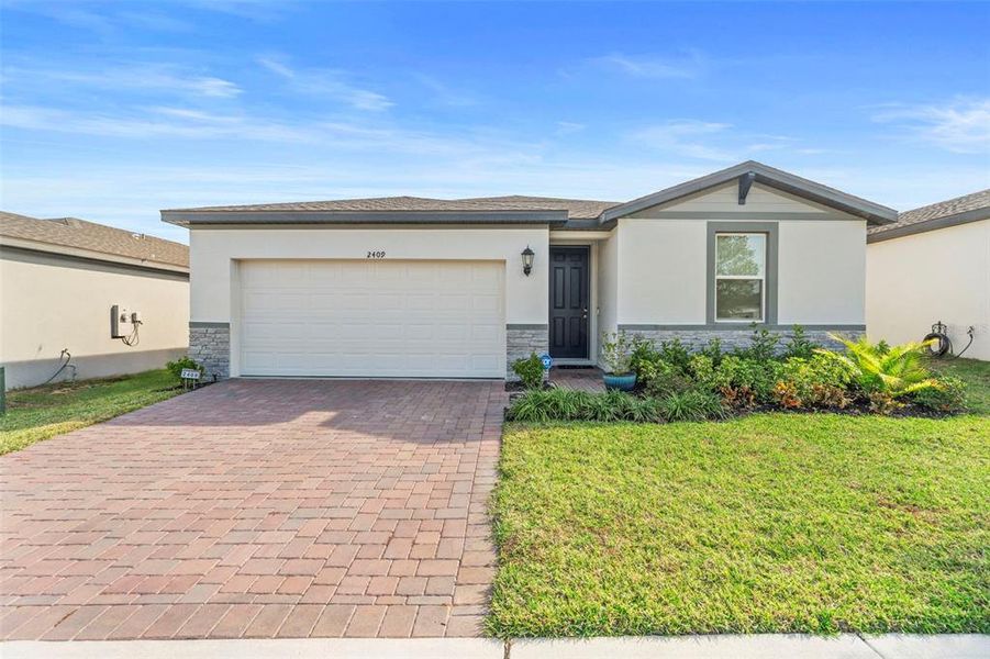 Front exterior of a new home in Deer Run at Crosswinds, Davenport, FL, highlighting curb appeal (Image 25).