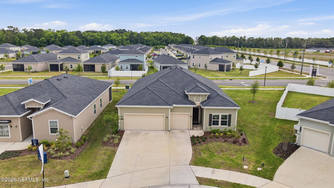 Front exterior of a new home in Saddle Oaks, Jacksonville, FL, highlighting curb appeal (Image 2). Front exterior of a new home in Saddle Oaks, Jacksonville, FL, highlighting curb appeal (Image 2).