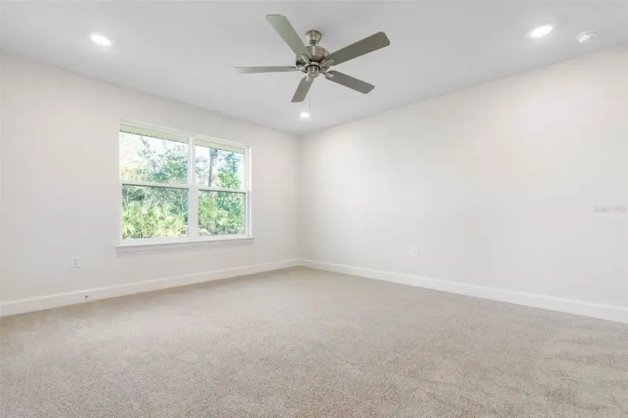 Representative unfurnished interior of a home built from the 2265 by Adams Homes in Flagler Estates, Hastings (Image 53).