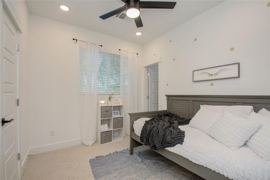 Secondary bedroom on the third floor! Photos from another community by the same builder, FINISHES & FLOOR PLAN MAY VARY! Ceiling fans are not included!