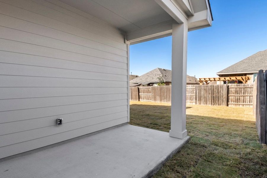 Fenced backyard featuring a patio