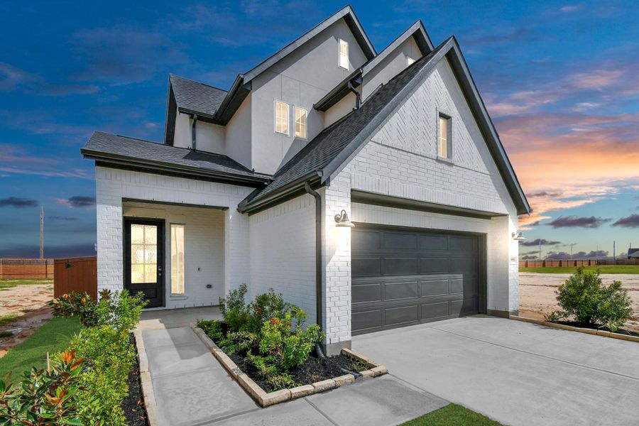 Front exterior of a new home in Elyson, Katy, TX, highlighting curb appeal (Image 20).