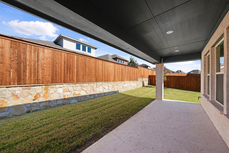Fenced backyard featuring a patio Fenced backyard featuring a patio