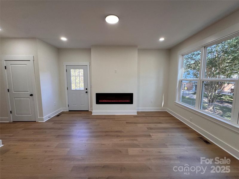Living room with electric fireplace.
