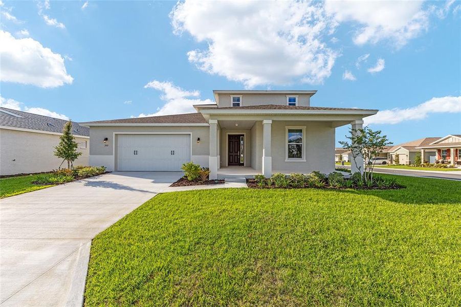 Front exterior of a new home in Calesa Township, Ocala, FL, highlighting curb appeal (Image 18).