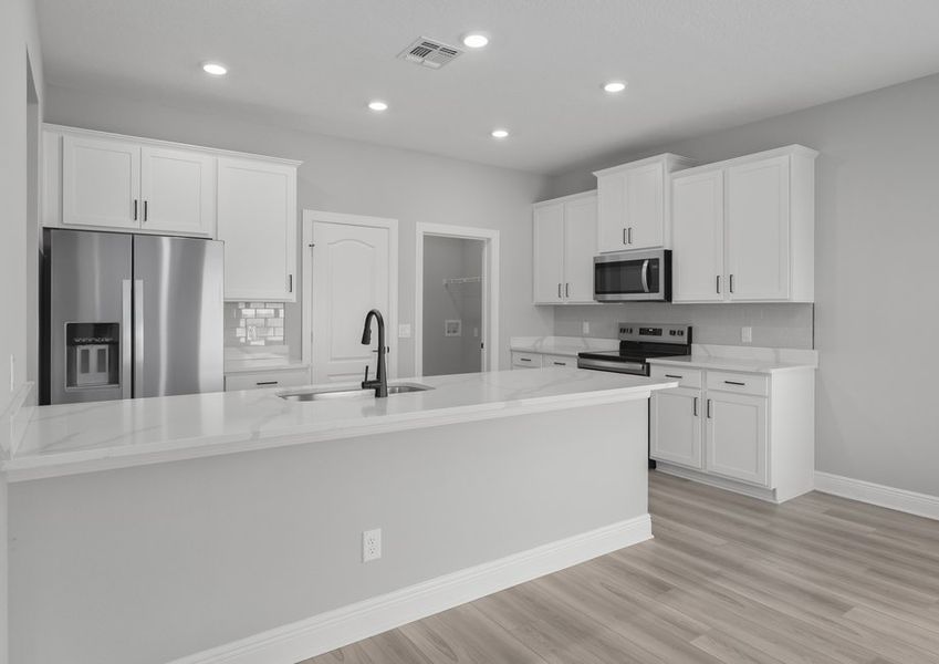 The spacious kitchen is perfect for preparing your family's favorite meals and treats.