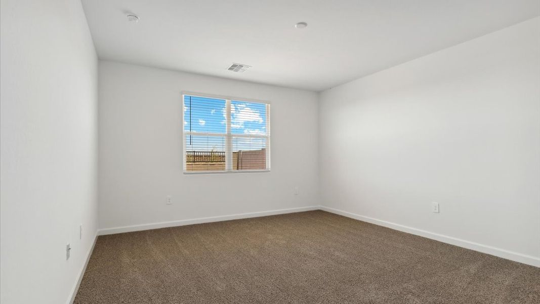 Spacious, unfurnished interior of a new home in Radiance at Superstition Vistas, Apache Junction (Image 24).