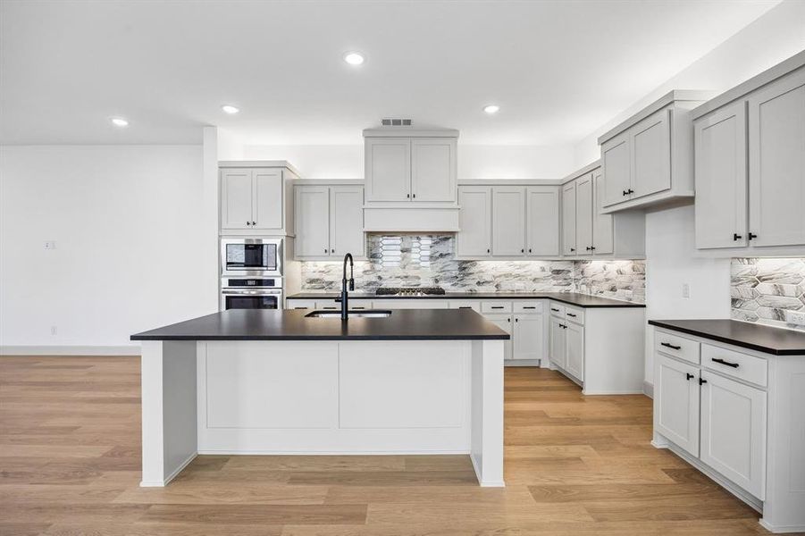 The spacious island is the hub of your new chef's kitchen and the perfect place for friends and family to gather round. The spacious island is the hub of your new chef's kitchen and the perfect place for friends and family to gather round.