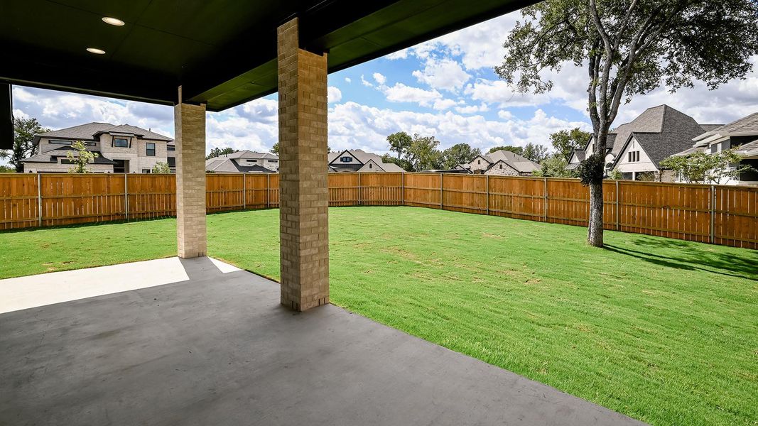 Fenced backyard featuring a residential view and a patio area