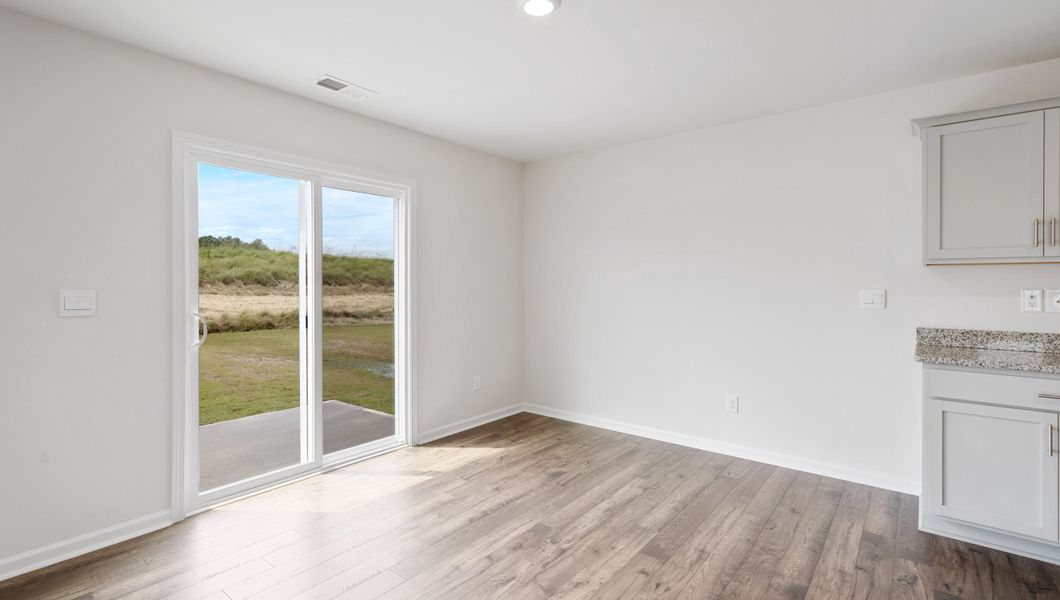 Representative unfurnished interior of a home built from the AISLE by D.R. Horton in Harrier Point, Woodruff (Image 12).