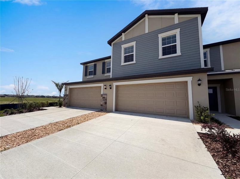 Front exterior of a new home in , Parrish, FL, highlighting curb appeal (Image 2). Front exterior of a new home in , Parrish, FL, highlighting curb appeal (Image 2).