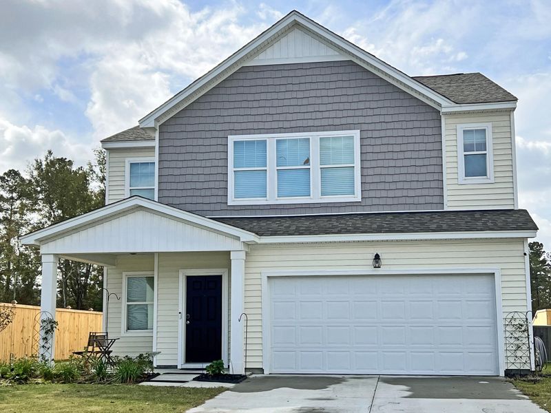 Front exterior of a new home in Watson Hill, Summerville, SC, highlighting curb appeal (Image 1).