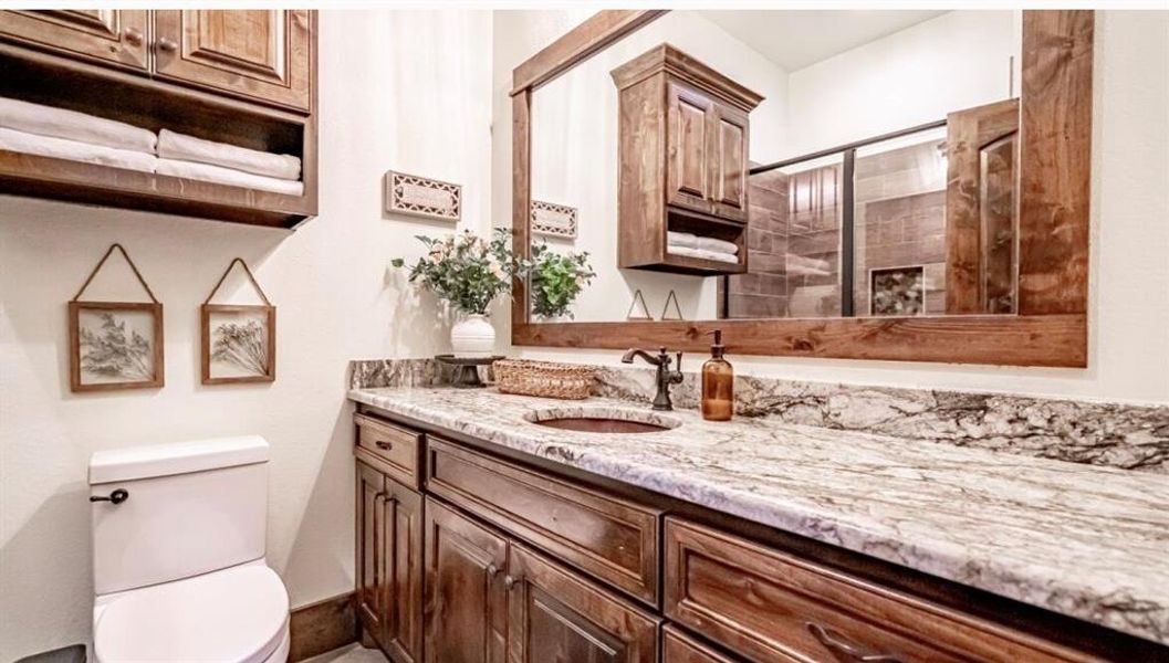 Bathroom with toilet and vanity Bathroom with toilet and vanity