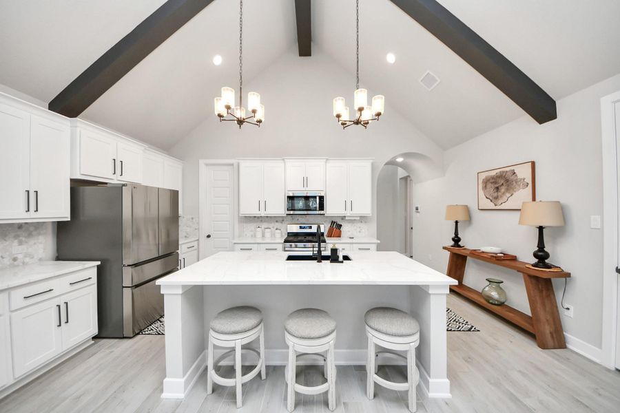 Entertainer’s layout—large prep island, pantry, and open sightlines.