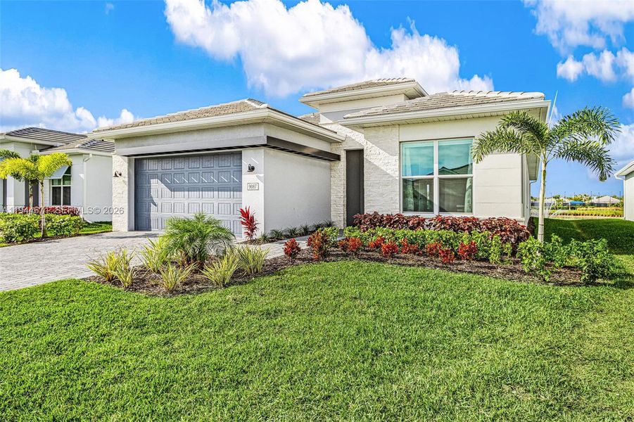 Front exterior of a new home in , Naples, FL, highlighting curb appeal (Image 25).