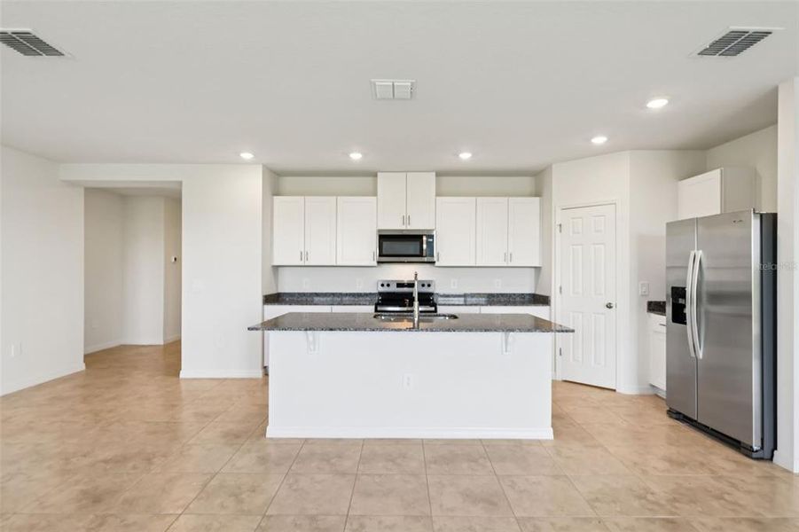Furnished interior view inside a new home in Lake Deer Estates - Signature Series, Poinciana (Image 6).
