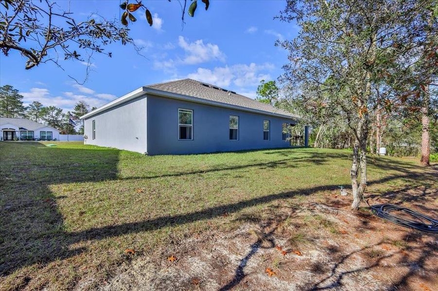 Exterior details and patio area of a home in Royal Highlands, Brooksville (Image 4).