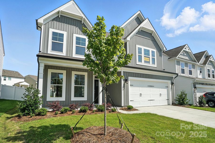 Front exterior of a new home in Hampton Woods, Charlotte, NC, highlighting curb appeal (Image 25).