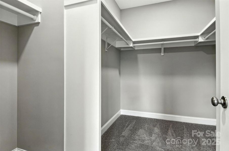 Primary bedroom walk in closet Primary bedroom walk in closet