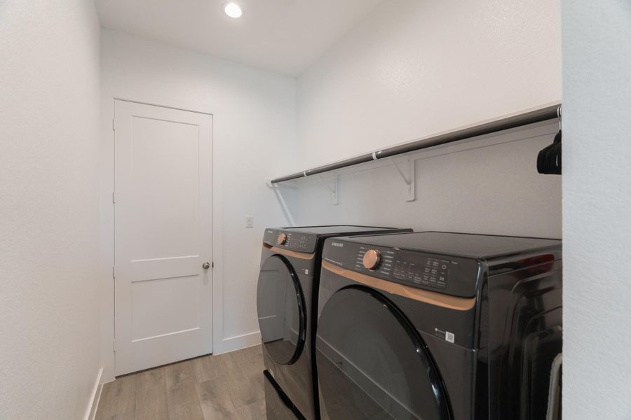 Laundry Room With Access To Primary Bedroom & Hallway.