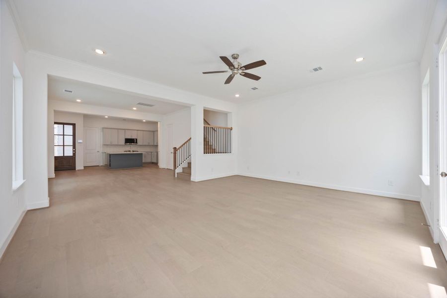 The heart of the home—wide open and effortlessly connected. This flexible living area flows right into the kitchen, keeping entertaining easy and everyday life comfortable.