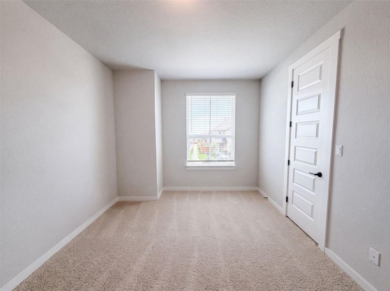 Sun-filled room offers plush carpeting and ample natural light through a generous window. Sun-filled room offers plush carpeting and ample natural light through a generous window.