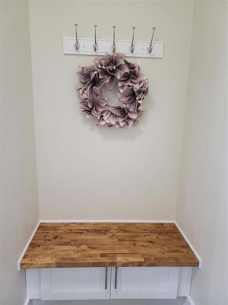 Custom designed area for drop zone/ mudroom by back door to garage.
