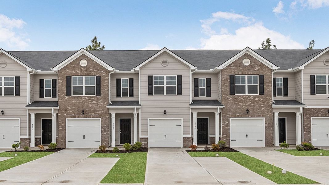 Front exterior of a new home in Laurel Park Townhomes, Hephzibah, GA, highlighting curb appeal (Image 2). Front exterior of a new home in Laurel Park Townhomes, Hephzibah, GA, highlighting curb appeal (Image 2).