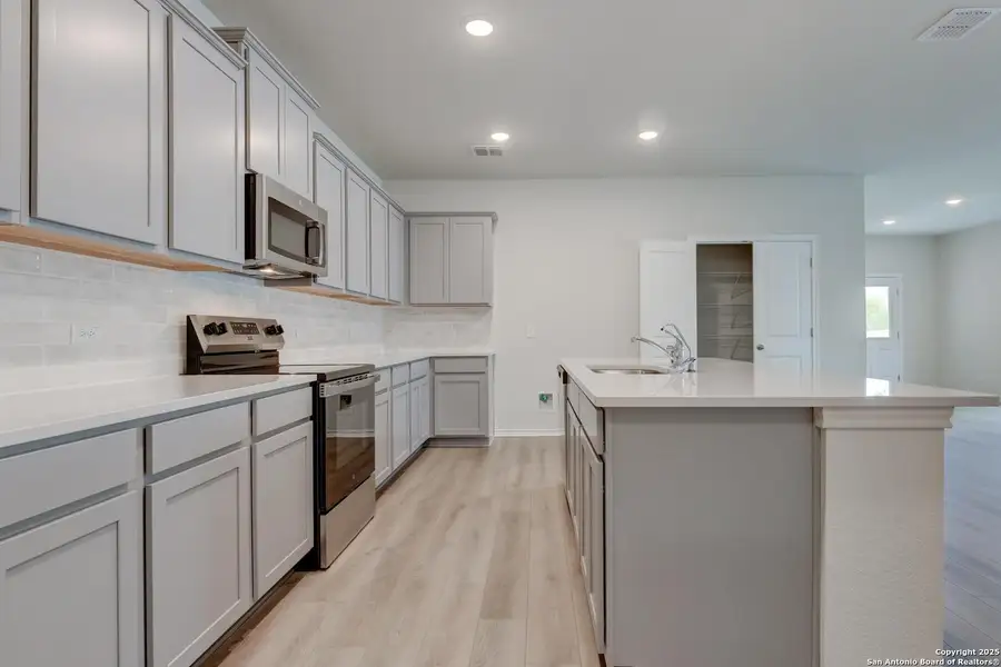 Furnished interior view inside a new home in Meadows at Hennersby Hollow 40's, San Antonio (Image 9).