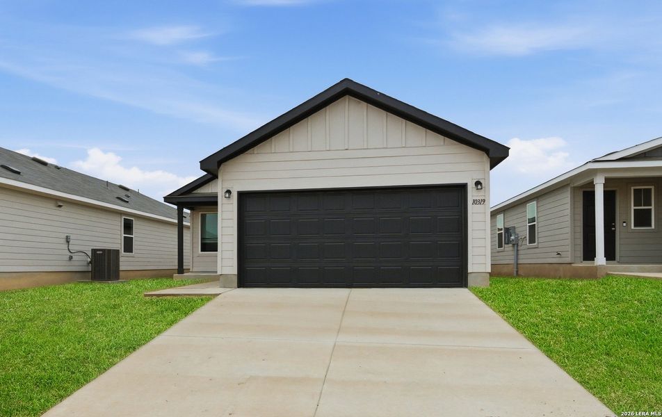 Front exterior of a new home in Vista Real, Converse, TX, highlighting curb appeal (Image 1). Front exterior of a new home in Vista Real, Converse, TX, highlighting curb appeal (Image 1).
