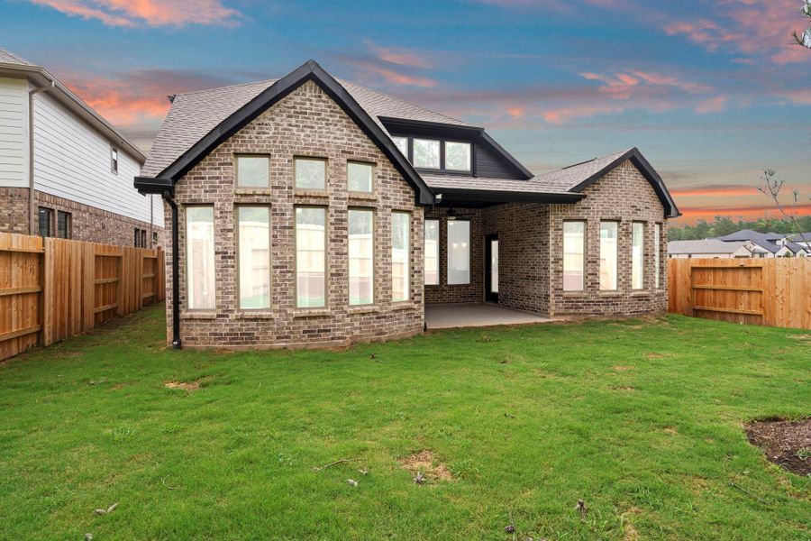 Exterior details and patio area of a home in Wildtree, Magnolia (Image 4).
