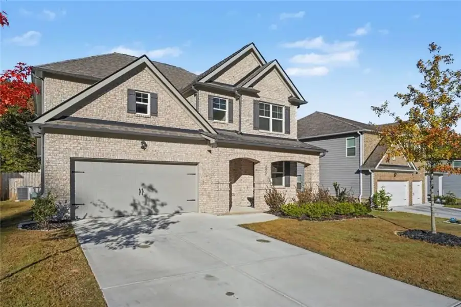Front exterior of a new home in Butner Estates, South Fulton, GA, highlighting curb appeal (Image 25).