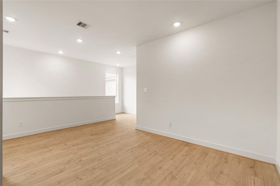 Flexible upstairs loft — ideal second living area or game room setup with clean trim details and ample wall space.